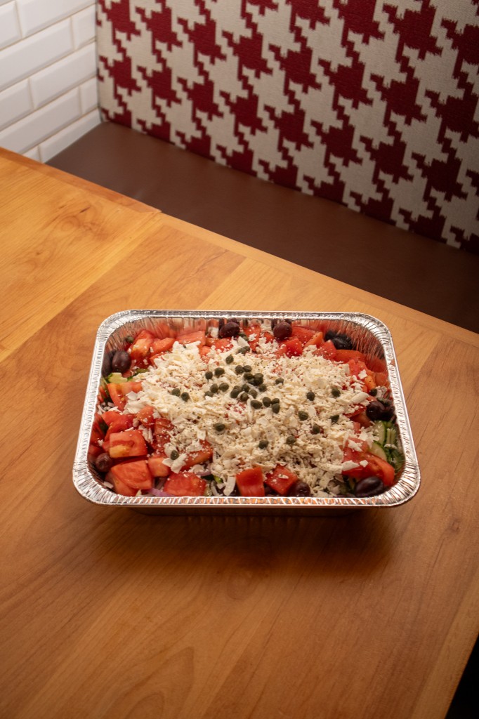 Catering tray of Greek salad with feta and olives