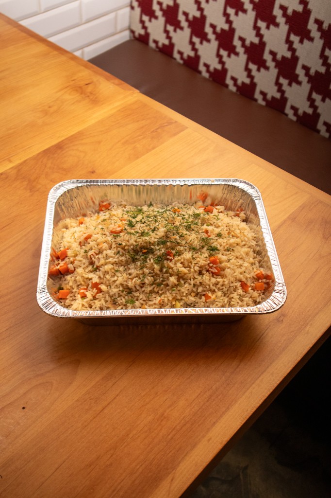Catering tray of seasoned rice with herbs